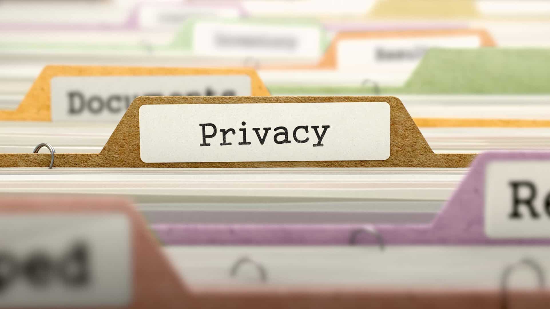 File Folder Labeled as Privacy in Multicolor Archive. Closeup View. Blurred Image.